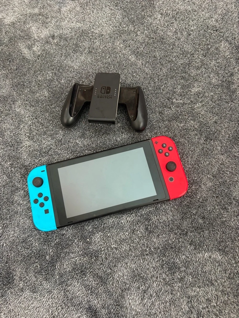 Nintendo Switch with Red & Blue Joy-Con Controllers + hand held controller